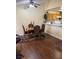 A dining area featuring hardwood floors, a table with four chairs, and modern lighting at 1800 Edmond St # 213, Las Vegas, NV 89146