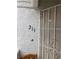 Close-up of front door showcasing unit number 213 and a security screen door for added peace of mind at 1800 Edmond St # 213, Las Vegas, NV 89146