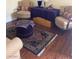 Inviting living room featuring hardwood floors, a sofa, and two armchairs with accent pillows at 1800 Edmond St # 213, Las Vegas, NV 89146