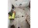 Concrete outdoor patio with stairs leading up, patio furniture, and a clothes drying rack at 1800 Edmond St # 213, Las Vegas, NV 89146