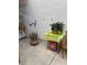 Enclosed patio space with small table and decorative flowers at 1800 Edmond St # 213, Las Vegas, NV 89146