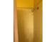 Shower stall featuring yellow tiling and a brushed metal shower head at 1800 Edmond St # 213, Las Vegas, NV 89146