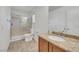 Bathroom showcasing a granite vanity top, glass-enclosed shower, and tiled flooring at 2020 Self Portrait St, Henderson, NV 89044