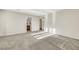 Large carpeted bedroom with multiple windows, en-suite bath, and walk-in closet at 2020 Self Portrait St, Henderson, NV 89044