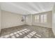 Spacious carpeted bedroom with bright, natural light streaming through the shutters at 2020 Self Portrait St, Henderson, NV 89044