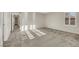 Spacious carpeted bedroom with bright, natural light streaming through the window at 2020 Self Portrait St, Henderson, NV 89044