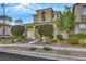 Two-story home with a well-maintained yard, walkway, and inviting entrance at 2020 Self Portrait St, Henderson, NV 89044