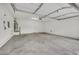Interior of a two car garage features white walls and a concrete floor at 2020 Self Portrait St, Henderson, NV 89044