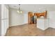 Open-concept kitchen and dining area with stainless steel appliances and warm wood cabinetry at 2020 Self Portrait St, Henderson, NV 89044
