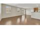 Open-concept living room with hardwood floors, plantation shutters, and natural light at 2020 Self Portrait St, Henderson, NV 89044