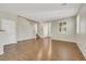 Bright living space with hardwood flooring, plantation shutters, and neutral paint at 2020 Self Portrait St, Henderson, NV 89044