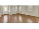 Inviting living room boasts hardwood floors and abundant natural light from shuttered windows at 2020 Self Portrait St, Henderson, NV 89044