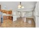 Open floor plan with modern kitchen and dining area flowing into the cozy living space at 2020 Self Portrait St, Henderson, NV 89044
