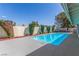 Swimming pool surrounded by lush landscaping in the backyard, perfect for summer enjoyment at 2254 Florence Ave, Las Vegas, NV 89119