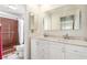 Bathroom features double sink vanity with tile flooring and a shower at 2254 Florence Ave, Las Vegas, NV 89119