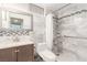 Updated bathroom features a modern vanity, new fixtures, tiled shower, and stylish decorative accents at 2254 Florence Ave, Las Vegas, NV 89119