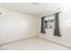 Bedroom with matching tile flooring, window, and curtains at 2254 Florence Ave, Las Vegas, NV 89119
