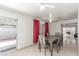 Dining area with sliding glass door and an adjacent living room at 2254 Florence Ave, Las Vegas, NV 89119