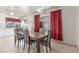 Dining area with a wooden table, seating for six, and access to the backyard at 2254 Florence Ave, Las Vegas, NV 89119