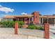 Lovely single-story home featuring a brick chimney and well-maintained front yard with a decorative retaining wall at 2254 Florence Ave, Las Vegas, NV 89119