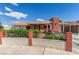 Charming single-story home featuring a brick chimney and well-maintained front yard with a garden wall at 2254 Florence Ave, Las Vegas, NV 89119