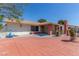 Charming home boasting a spacious front yard with mature trees and vibrant landscaping with a brick chimney at 2254 Florence Ave, Las Vegas, NV 89119