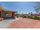 Expansive brick-paved front yard of a well-maintained home featuring mature trees and charming curb appeal at 2254 Florence Ave, Las Vegas, NV 89119