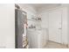 A dedicated laundry area with a washer and dryer, providing convenient space for household chores at 2254 Florence Ave, Las Vegas, NV 89119