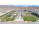Aerial view of a planned community with a pool and park at 2677 Saddle Bronze Ct, North Las Vegas, NV 89086