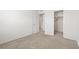 Neutral carpeted bedroom with an open closet at 2677 Saddle Bronze Ct, North Las Vegas, NV 89086