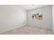 Minimal bedroom featuring neutral carpet and window at 2677 Saddle Bronze Ct, North Las Vegas, NV 89086