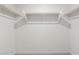 Walk-in closet features ample storage space with double-hanging rods and white trim at 2677 Saddle Bronze Ct, North Las Vegas, NV 89086