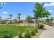 Community park with lush greenery, playground, and recreational area at 2677 Saddle Bronze Ct, North Las Vegas, NV 89086
