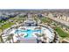 Aerial view of a modern community pool and recreation area with lounging and open space at 2677 Saddle Bronze Ct, North Las Vegas, NV 89086