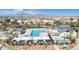 Aerial of community pool and lounge area perfect for relaxation and socializing at 2677 Saddle Bronze Ct, North Las Vegas, NV 89086