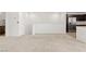 Upstairs living area with carpet floors adjacent to the modern kitchen area at 2677 Saddle Bronze Ct, North Las Vegas, NV 89086