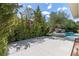 Relaxing backyard with a pool, lush greenery, and a spacious patio area, ideal for enjoying the outdoors at 29 Owl Ridge Ct, Las Vegas, NV 89135