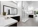Sleek bathroom with a glass-enclosed shower, dual vanity, and contemporary finishes at 29 Owl Ridge Ct, Las Vegas, NV 89135