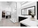 Modern bathroom featuring a glass-enclosed shower, dual vanities, and sleek fixtures at 29 Owl Ridge Ct, Las Vegas, NV 89135