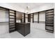 Walk-in closet with custom shelving and storage at 29 Owl Ridge Ct, Las Vegas, NV 89135