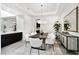 Elegant dining room featuring a modern chandelier and stylish decor at 29 Owl Ridge Ct, Las Vegas, NV 89135