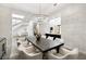 Modern dining room with stylish lighting, seating for eight, and elegant accents at 29 Owl Ridge Ct, Las Vegas, NV 89135