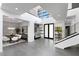 Open-concept foyer with dining area, staircase, and soaring ceilings at 29 Owl Ridge Ct, Las Vegas, NV 89135
