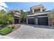Stunning contemporary home featuring a stylish paved driveway and stone accents at 29 Owl Ridge Ct, Las Vegas, NV 89135