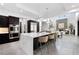 Open-concept kitchen with a marble island, stainless steel appliances, and modern lighting at 29 Owl Ridge Ct, Las Vegas, NV 89135