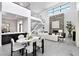 Open floor plan with dining area, living room with fireplace and contemporary staircase at 29 Owl Ridge Ct, Las Vegas, NV 89135