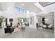 Spacious open-concept living and dining area with modern furnishings and outdoor access at 29 Owl Ridge Ct, Las Vegas, NV 89135