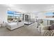 Stylish living area with a large sectional, modern railing and bright, natural light at 29 Owl Ridge Ct, Las Vegas, NV 89135