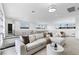 Bright living area with a comfortable sectional sofa, modern decor, and natural light at 29 Owl Ridge Ct, Las Vegas, NV 89135