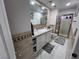 Contemporary bathroom featuring a stylish vanity, large mirror, and a glass shower at 2913 Domino Way, Las Vegas, NV 89117